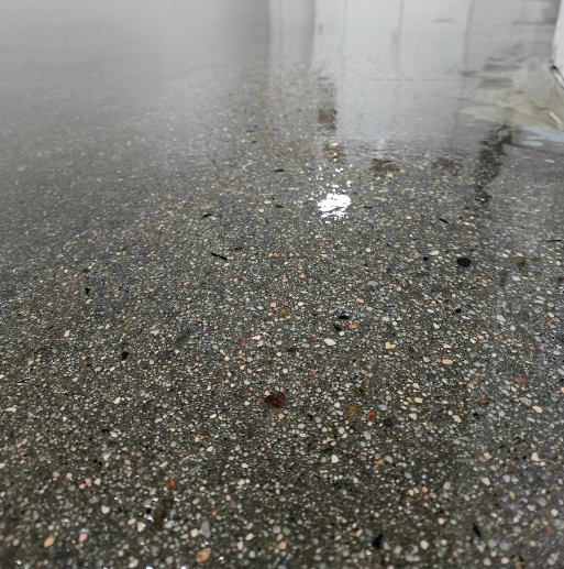 Enhance your space with polished concrete, a durable, glossy flooring solution requiring no additional coatings. Perfect for offices, retail, and warehouses.