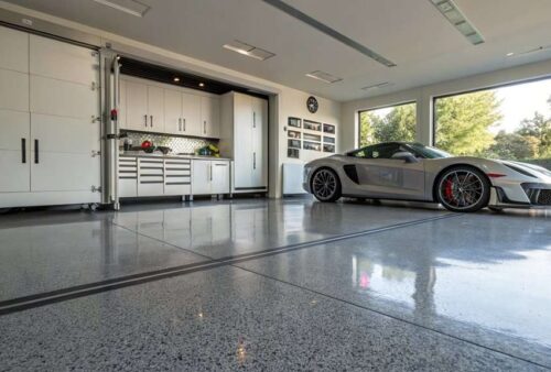 You'll discover how epoxy flooring transforms garages into stunning, durable spaces while boosting property value and reducing maintenance costs.