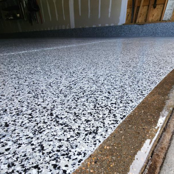 Discover what an epoxy garage floor coating is, how it works, and why EvrStep’s multi-layered systems offer lasting durability and a polished finish.