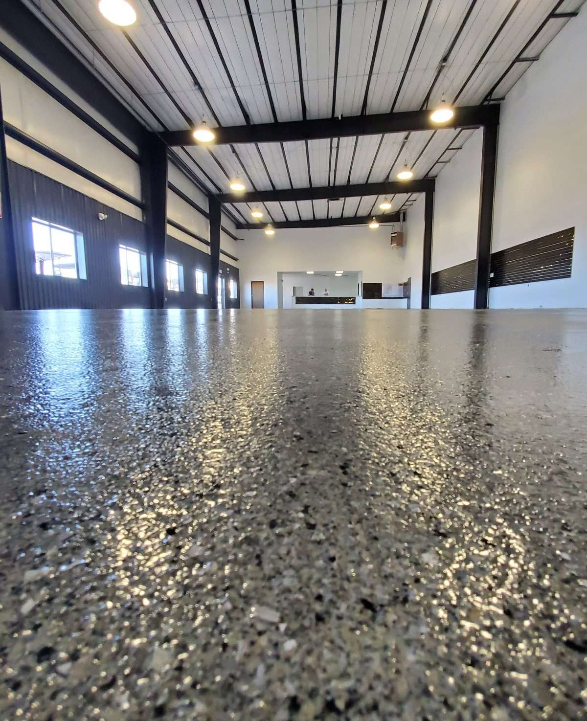 Commercial epoxy floor coating in a Colorado warehouse
