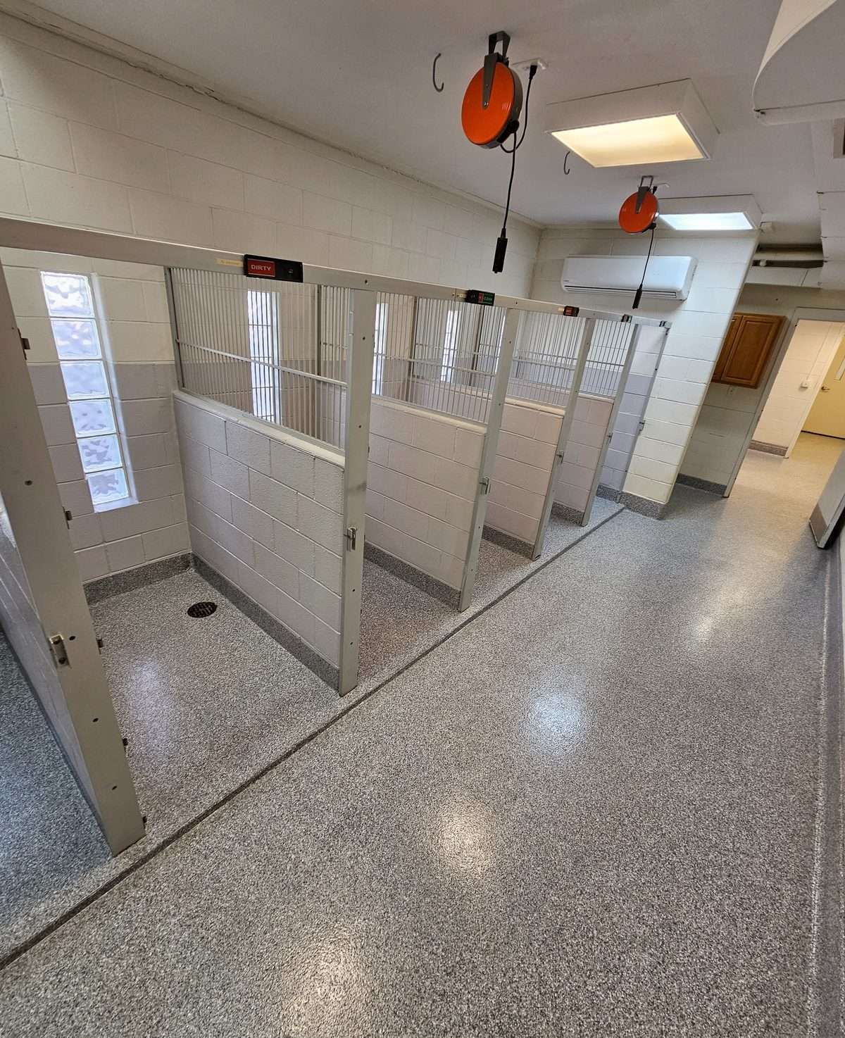 Enhance durability with commercial flake coatings, ideal for dog kennels and high-traffic spaces.