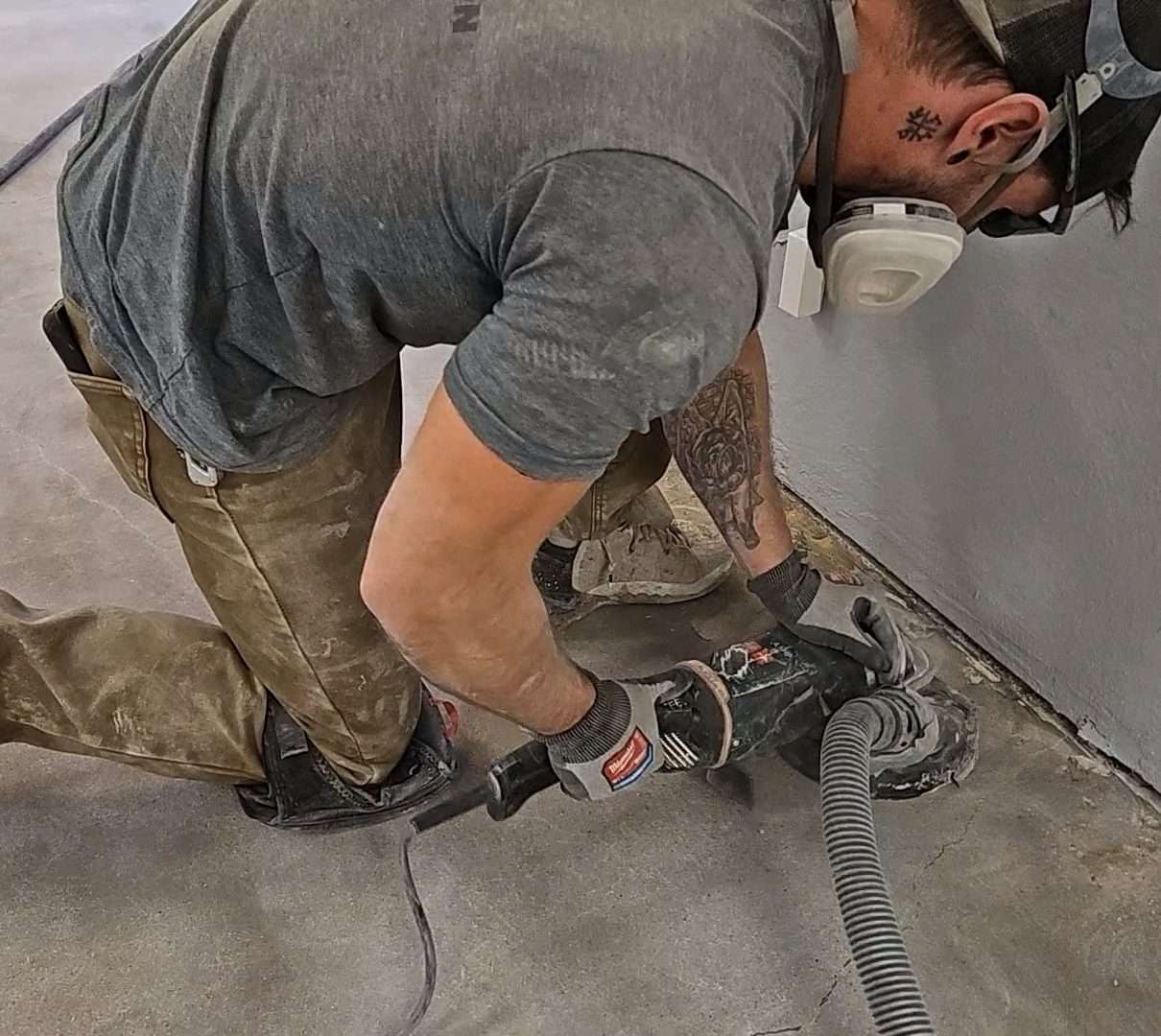 EvrStep crew grinding concrete during floor prep