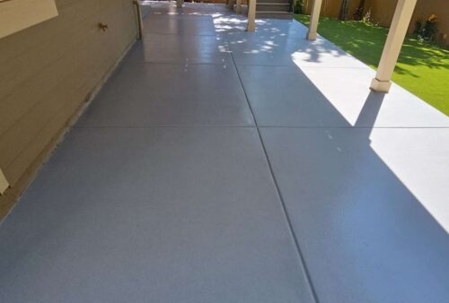 Coated exterior walkway alongside a home in Colorado