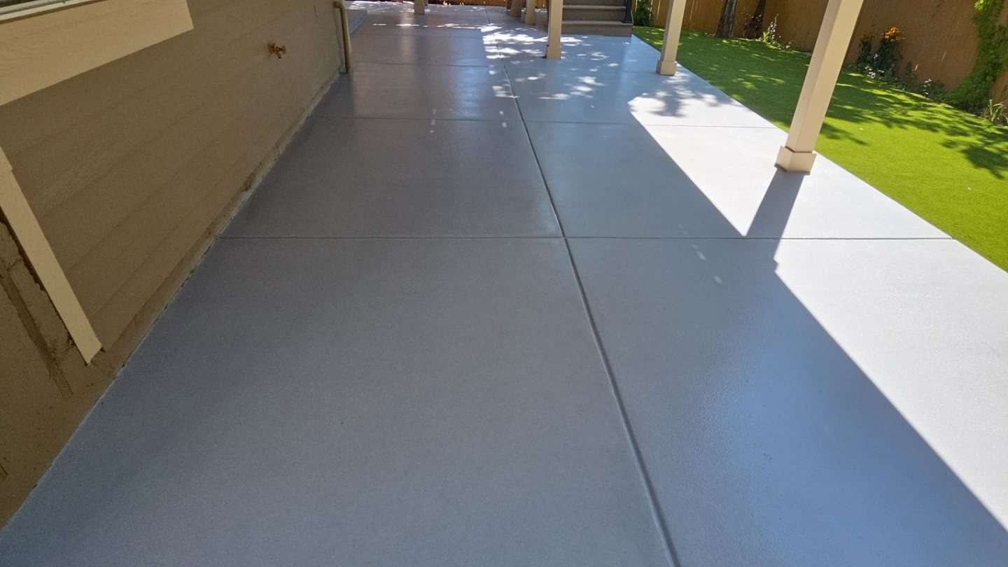 Coated exterior walkway alongside a home in Colorado
