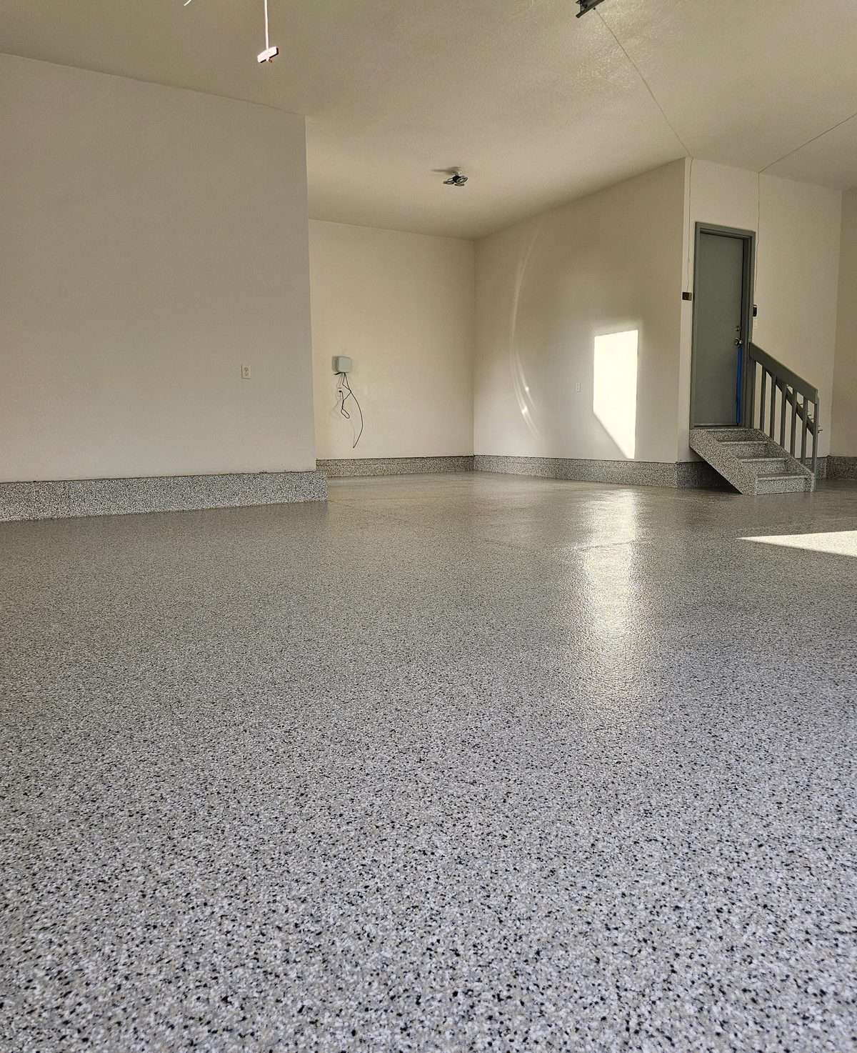 Flake system garage floor coating in a Colorado home
