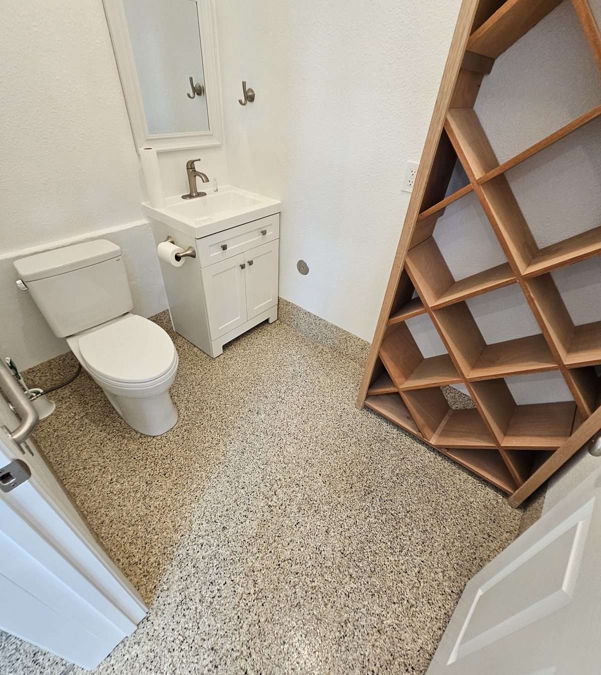 Quartz floor coating in a commercial restroom