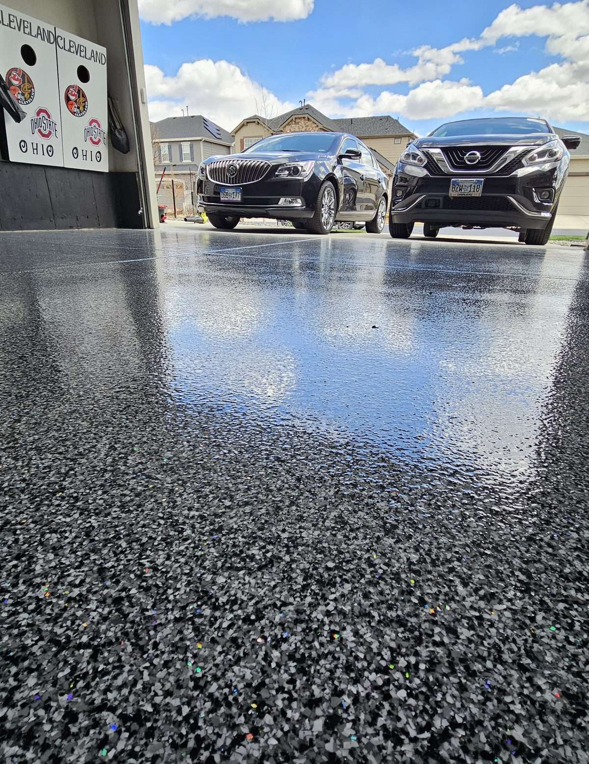 Vehicles parked on a finished flake garage floor